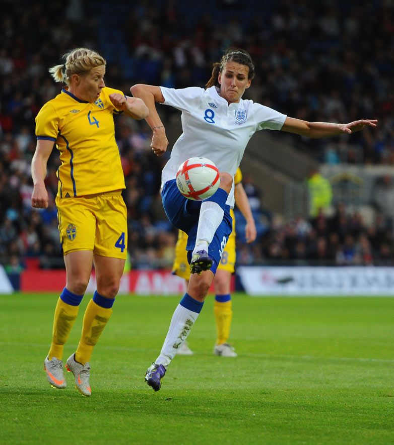 Jill Scott battles with Annica Svensson during England's 2-0 win over Sweden at Oxford United's Kassam Stadium.